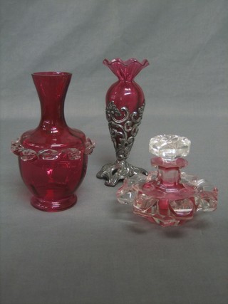 A red cut glass scent bottle and stopper 5", a cranberry glass vase contained in a pierced plated mount 7", a cranberry glass club shaped vase 7"