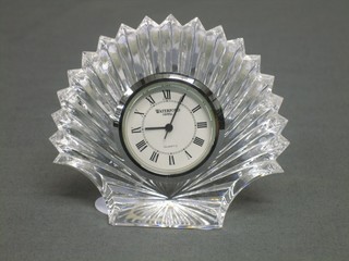A Waterford Crystal clock contained in a glass scallop shaped case 3 1/2"