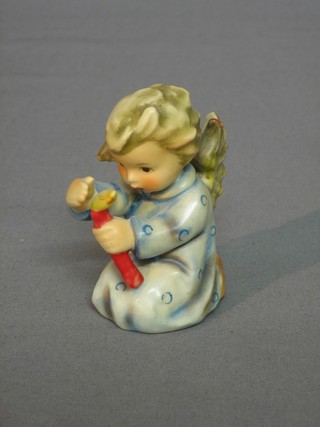 A Hummel figure of an Angel kneeling with candle 3"