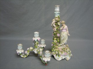 A handsome Continental floral encrusted 5 light candelabrum supported by a figure of a girl and cherub 21 1/2"