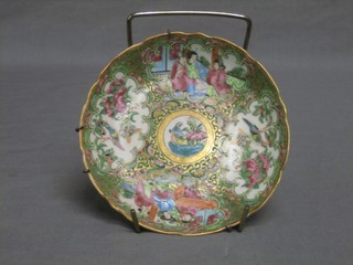 A 19th Century circular Canton porcelain saucer decorated court figures 5 1/2"