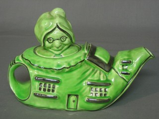 A Lingard ware green glazed teapot - The Old Woman Who Lived in a Shoe 9"
