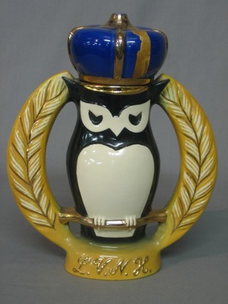 A  Licensed Victuallers At Home twin handled pottery decanter in the form of an owl containing Beam whiskey 10"