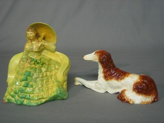 A Wade pottery figure of a seated Crinoline lady, the base marked Romance II 6" (some damage to flowers?) together with an Art Deco pottery figure of an Afghan hound 9"
