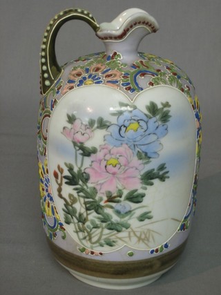 An Oriental porcelain jug decorated flowers and figures 8" (some crackling)
