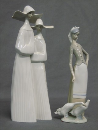 A Lladro figure group of 2 standing nuns 12" (f and r) and 1 other of a girl with geese 11" (f and r)
