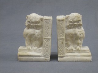 A pair of plaster book ends in the form of owls 5"