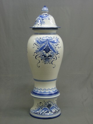 A large and impressive Continental pottery urn and cover with base, the base marked Gialletti Gulio Dervet 45"
