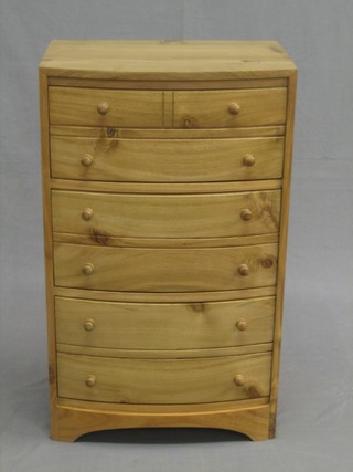 A Georgian style bleached mahogany bow front apprentice chest fitted 2 short and 5 long dummy drawers, raised on bracket feet 18"