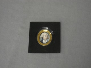 A head and shoulders portrait miniature of a gentleman contained in a metal frame 2"