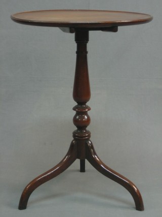 A 19th Century circular mahogany snap top wine table, raised on pillar and tripod supports 21"