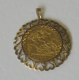 A George V 1912 half sovereign contained in a 9ct gold pendant mount