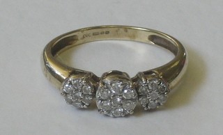 A 9ct gold gold cluster dress ring set 3 illusion set diamonds