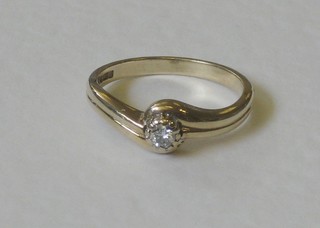 A 9ct gold dress ring set a solitaire diamond