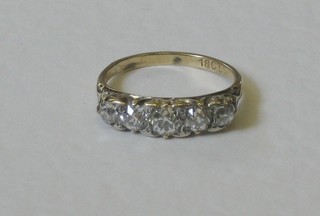 A lady's 18ct gold dress ring set 5 circular cut diamonds