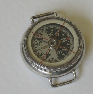 A compass contained in a silver wristwatch case, London 1914