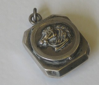 A curious  locket decorated a horses head containing a miniature telescope