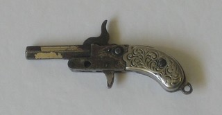 A miniature percussion firing pistol 2"