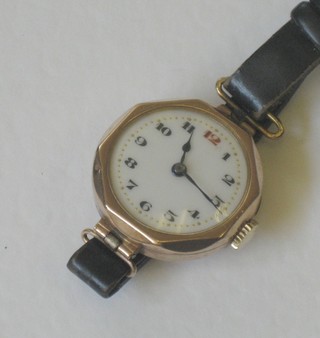 A lady's 9ct gold cased wristwatch with enamelled dial and Arabic numerals