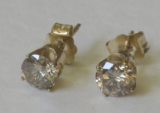 A pair of 14ct gold diamond stud earrings