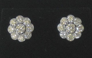 A pair of 18ct gold cluster earrings, approx 1.70ct