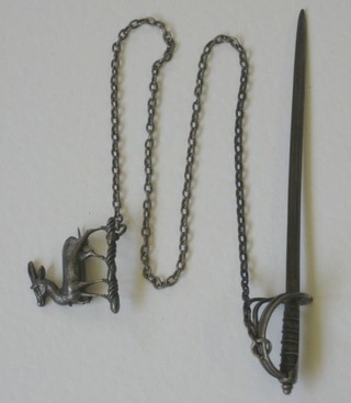 A paper knife in the form of a sword with 5" blade hung on a silver chain with deer brooch