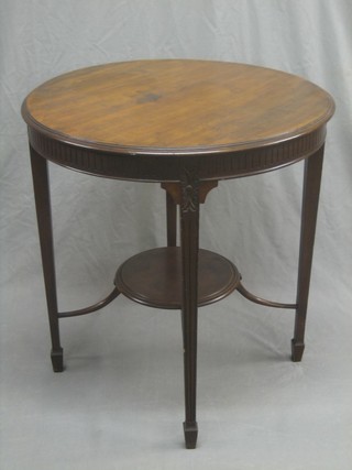 An Edwardian circular walnut 2 tier occasional table with fluted decoration, raised on square tapering supports 27"