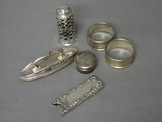 2 silver napkin rings, a small silver rouge pot, a nail buffer, embossed pierced silver pepperette and a small silver case