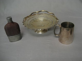 A Victorian glass flask with detachable cup, a silver plated pint tankard and a a pierced silver plated cake basket with swing handle