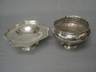 A silver plated rose bowl with spreader and a silver plated cake basket with swing handle