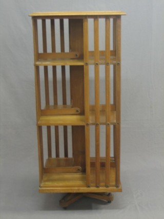 A Victorian square bleached mahogany revolving bookcase 20"