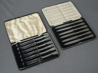 2 sets of 6 tea knives with silver handles, cased