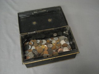 A metal hat box and a collection of coins