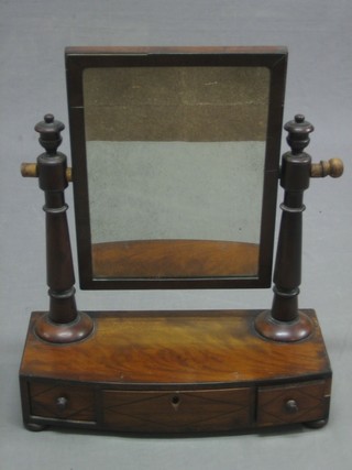 A Victorian rectangular mahogany plate dressing table mirror, contained in a mahogany swing frame on a bow front base, fitted 1 long drawer flanked by 2 short drawers, raised on bun feet 17"