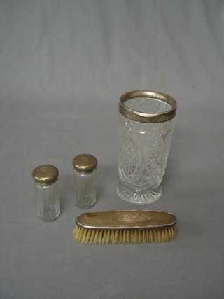 A circular cut glass vase with silver mount 7" (chip to base), 2 cut glass pin jars and a silver backed clothes brush