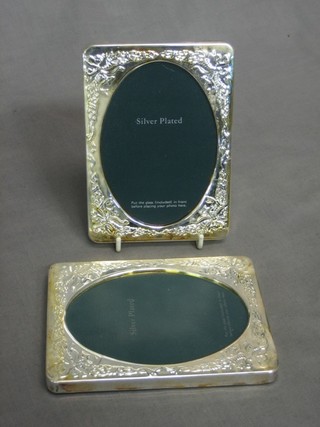A pair of modern embossed silver plated easel photograph frames 5 1/2" x 4"