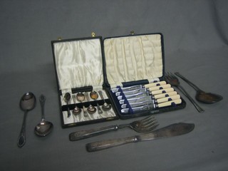 A pair of silver plated fish servers, do. salad servers, do. serving spoons, 6 tea knives and 6 silver plated tea spoons, all cased
