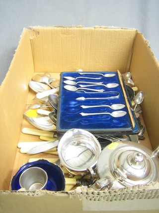 A Britannia metal teapot, plated sugar bowl and a quantity of silver plated flatware