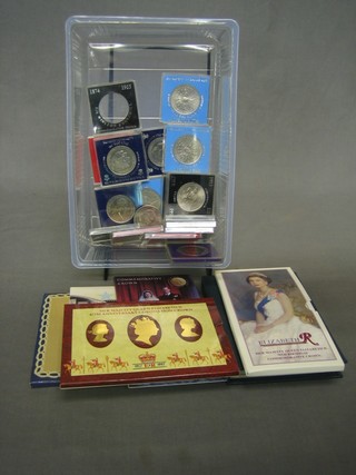 A 1985 set of proof coins, 5 other sets of coins and a small collection of crowns