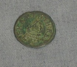 An early hammered copper coin with crowned harp, crossed sceptres and crown
