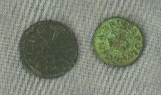 An early copper coin with crown, Tudor rose and crown with 2 crossed swords and 1 other early coin with crown and harp