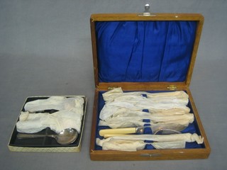 A set of 6 silver plated fish knives and forks contained in an oak canteen box and 8 soup spoons