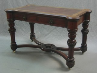 A Victorian mahogany Gothic style library table with inset tooled leather writing surface above 2 short drawers, raised on turned and fluted supports with X framed stretcher 48"