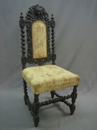A Victorian carved oak Carolean style high back chair with tapestry style seat and back, raised on turned and block supports