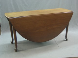A handsome Georgian mahogany oval drop flap gateleg dining table, raised on club supports 16"