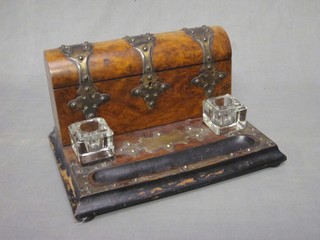A Victorian walnut standish, fitted an arched stationery box with hinged lid, the base with 2 associated inkwells and pen recess 12"