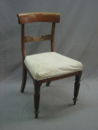 A 19th Century mahogany bar back dining chair with carved mid rail and upholstered seat, raised on turned and reeded supports