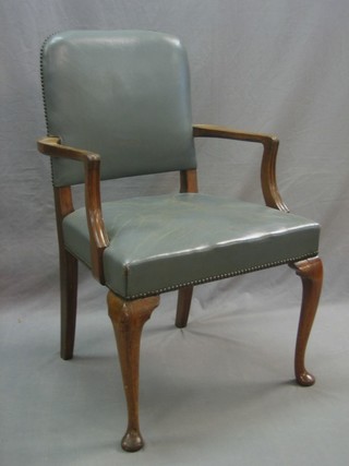 A Queen Anne style walnut open arm library chair with upholstered seat and back, raised on cabriole supports