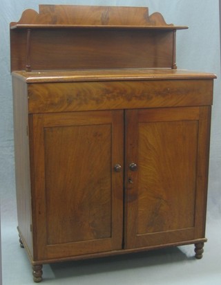 A 19th Century mahogany chiffonier with raised back, the base fitted a drawer above double cupboard enclosed by panelled doors, raised on bun feet 35"