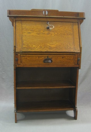 An Art Nouveau honey oak student's bureau with fall front, the base fitted a drawer above a shelf 31"